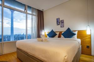 Ένα ή περισσότερα κρεβάτια σε δωμάτιο στο Yemala Suites at Vortex KLCC +57 φωτογραφίες