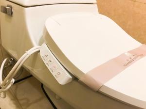 a close up of a toilet in a hospital room at Hotel Dion in Taichung