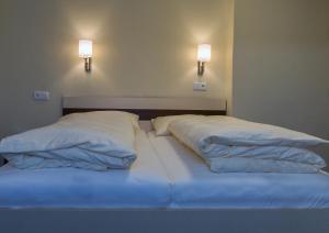 Hotel Guidassoni客房内的一张或多张床位