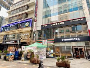 a group of buildings in a city with a street at Ocloud Hotel Gangnam in Seoul