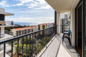 a balcony with a view of a city at Acacia Apartment by Atlântica in Funchal