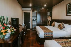 Postel nebo postele na pokoji v ubytování Arthur Suites by Mahavilas