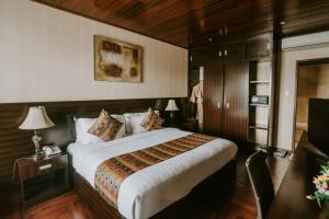 Postel nebo postele na pokoji v ubytování Arthur Suites by Mahavilas