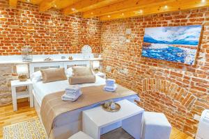 Postel nebo postele na pokoji v ubytování New Lux Villa Merissima
