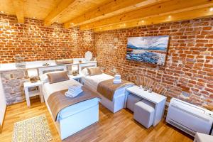 Postel nebo postele na pokoji v ubytování New Lux Villa Merissima