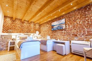 Postel nebo postele na pokoji v ubytování New Lux Villa Merissima