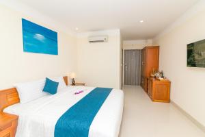 Postel nebo postele na pokoji v ubytování Navy Hotel Cam Ranh