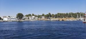 a large body of water with boats in it at NiLe ViEW RANA NUbian Guest HOUES in Aswan