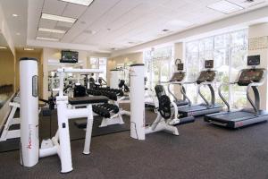 a gym with treadmills and machines in a room at Holiday Inn Baton Rouge College Drive I-10, an IHG Hotel in Baton Rouge