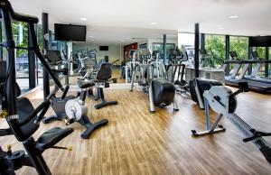 a gym with treadmills and elliptical machines at Holiday Inn Bristol City Centre by IHG in Bristol +48 photos