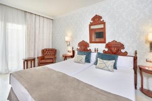 a bedroom with a large bed and a mirror at Bordoy Continental Palma in Palma de Mallorca +93 photos