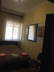 Кровать или кровати в номере Апартаменты в Ессентуках