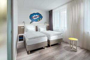 Postel nebo postele na pokoji v ubytování Comfort Hotel Prague City