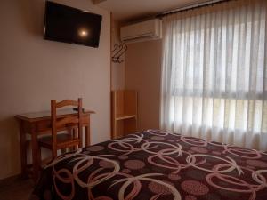 Postel nebo postele na pokoji v ubytování Hostal Durá + 5 fotografií