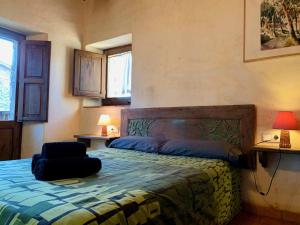 Un pat sau paturi într-o cameră la Can Vila