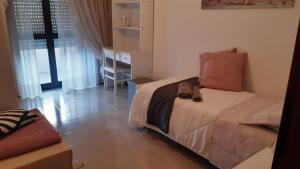 Ένα ή περισσότερα κρεβάτια σε δωμάτιο στο VILLETTA DI CHARME IN CENTRO CITTA'