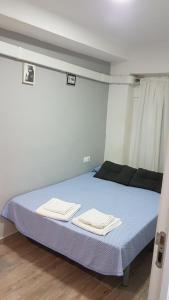 Postel nebo postele na pokoji v ubytování Guesthouse Central