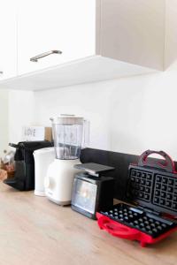 a kitchen counter with a food processor and a blender at Rock in Share - Le Saint-Pierre in Metz