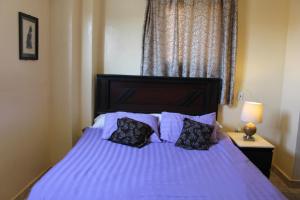 Letto o letti in una camera di Pyramids Overlook Inn