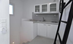 Kuchyňa alebo kuchynka v ubytovaní Dream House "A"