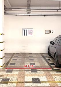 a parking garage with a car parked in it at Happy Home Bo Centro FREE PRIVATE PARKING in Bologna