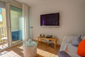 A television and/or entertainment centre at La Marina Sea Front by Hello Homes Sitges