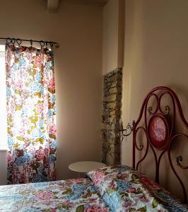 Posteľ alebo postele v izbe v ubytovaní Casa Tarò