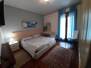 Postel nebo postele na pokoji v ubytování Le 3 Camelie Malpensa