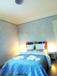 מיטה או מיטות בחדר ב-Appartement St Martin du Canigou