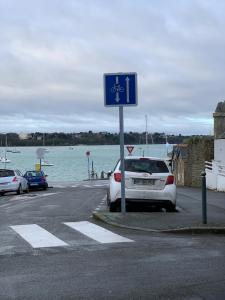 a car parked in a parking lot next to the water at Le Cap Solidor in Saint Malo