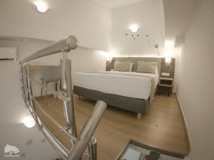 Costa Point Chios tesisinde bir odada yatak veya yataklar