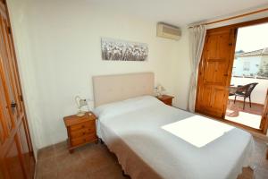 Posteľ alebo postele v izbe v ubytovaní Casa Voramar