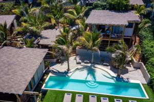 an aerial view of a resort with a swimming pool at Adobe Villas in Máncora