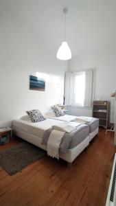 Ein Bett oder Betten in einem Zimmer der Unterkunft Espinho Guesthouse - Garden House
