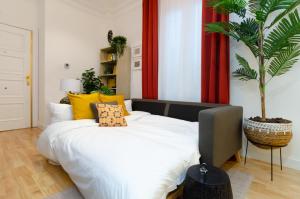 Una cama o camas en una habitación de Palacio Premium Stay