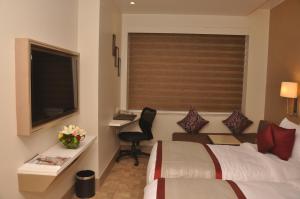 Postel nebo postele na pokoji v ubytování Days Hotel Jaipur Tonk Road By Wyndham