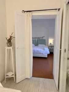 Postel nebo postele na pokoji v ubytování Dolce Vita Suite Alghero