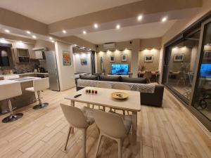 a living room with a couch and a table at Super Loft With Acropolis View in Athens