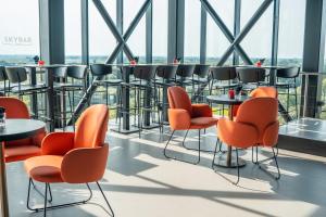 a dining room filled with chairs and tables at Corendon Urban Amsterdam Schiphol Airport Hotel in Badhoevedorp