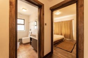 Ένα ή περισσότερα κρεβάτια σε δωμάτιο στο Uma Residency