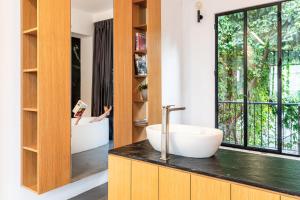 a bathroom with two sinks on a counter at The Wall by HolyGuest in Tel Aviv