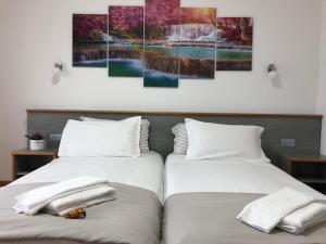 Katil atau katil-katil dalam bilik di Hotel Garni Montaldi