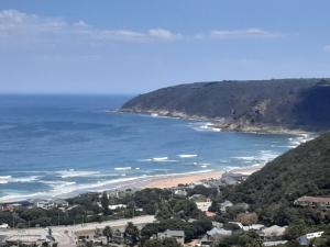 a view of a beach and the ocean at Bly-Uitzicht in Wilderness