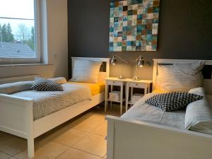 Postel nebo postele na pokoji v ubytování Luxus-Apartment Quierschied