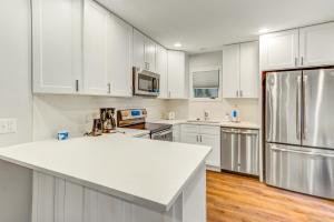 a kitchen with white cabinets and a white counter top at Night Heron 4117 in Kiawah Island