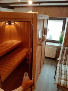 a room with a sauna with a window at Ferienhaus Elisa in Trittenheim