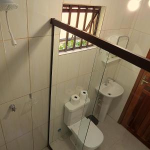 a bathroom with a toilet and a sink at Recanto Abayomi in Ilha do Mel +40 photos
