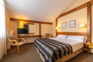 Кровать или кровати в номере Sport Hotel
