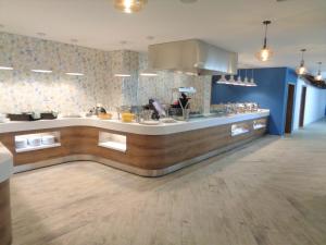 Kuchyň nebo kuchyňský kout v ubytování Hotel Santana