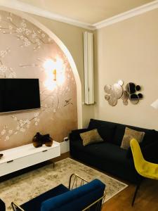Televízia a/alebo spoločenská miestnosť v ubytovaní Porta Ticinese Apartment